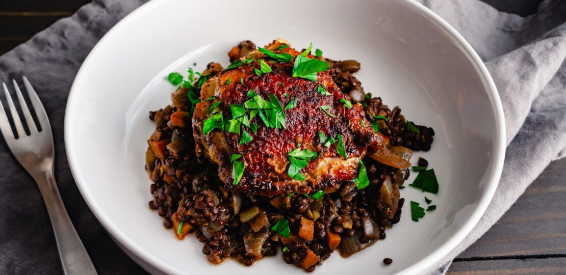 bowl of crispy berbere chicken with ethiopian lentils