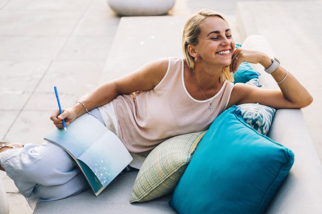 Woman journaling outdoors — Wellness Affirmation Journal
